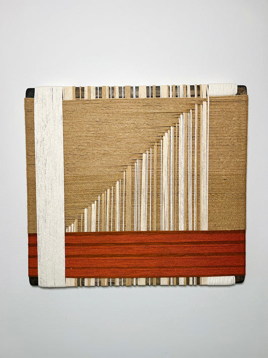 The image is a rectangular piece of art featuring a geometric design with a combination of brown, white, and red colors.