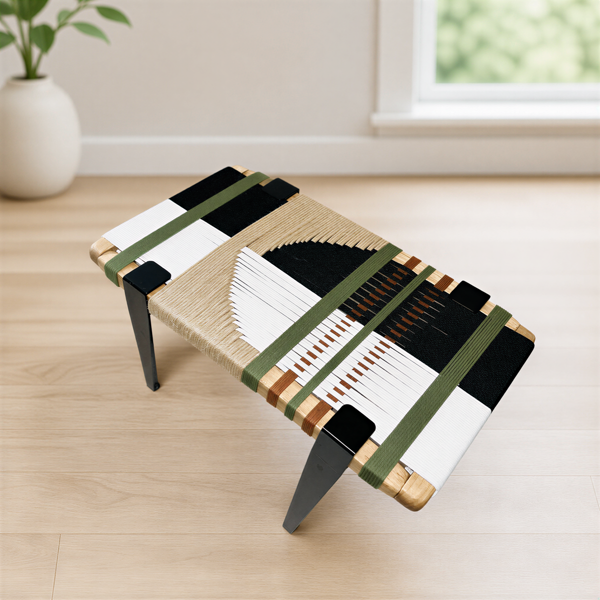 a modern, wooden coffee table with a unique, abstract design. The table has a combination of black, white, and brown elements, creating a visually striking contrast. The table is placed on a wooden floor, and there is a window in the background, allowing natural light to illuminate the scene.