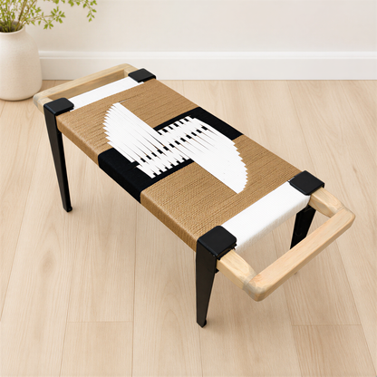 a modern, wooden bench with a woven seat and black metal legs. The bench has a unique design with a black and white geometric pattern on the seat and legs.