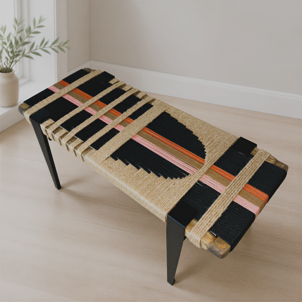 a modern, woven bench with a black and orange color scheme, placed on a wooden floor in a room with a window.