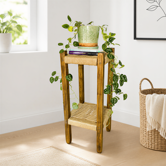 a wooden side table with a woven seat and a green plant on top, situated in a room with a window and a woven basket.